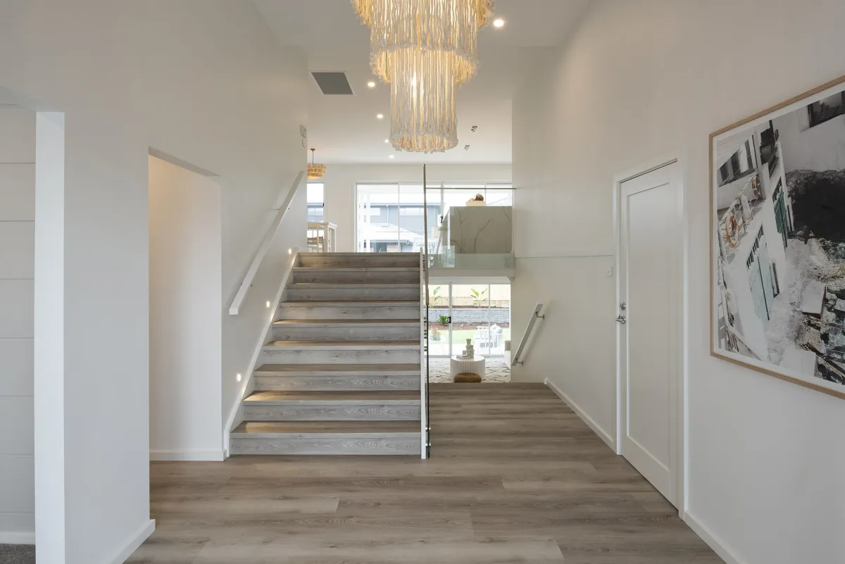 Staircase and Chandelier in Split Level Home Design